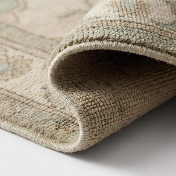 Translation missing: en.Close-up of hand knotted wool rug showing dense pile, natural wool fibers, and knot structure