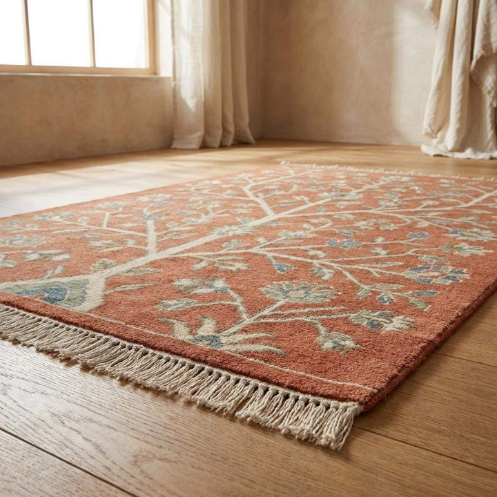 Translation missing: es.Artisan made terracotta wool rug with floral vine pattern and soft matte finish