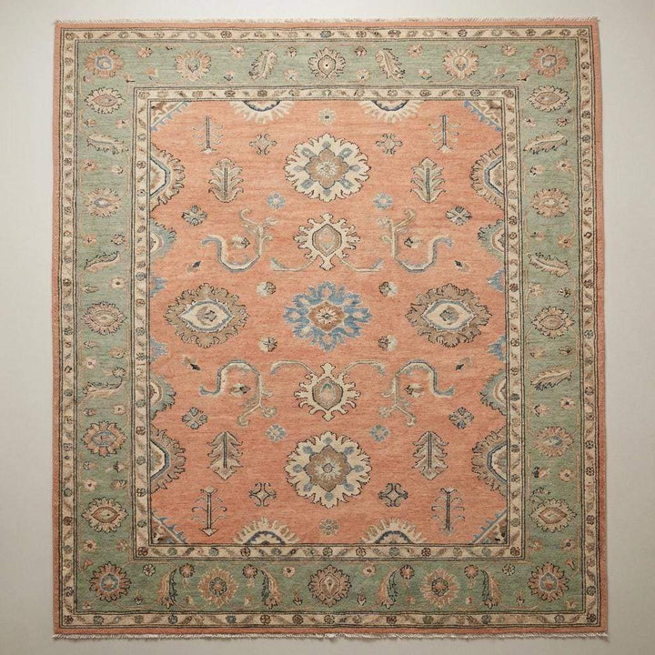 Translation missing: en.Detailed view of floral medallion and vine motifs on a hand knotted wool rug with Persian-inspired Oushak design