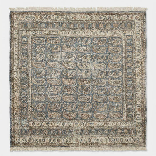 Translation missing: en.Traditional blue and ivory hand knotted rug with repeating paisley design