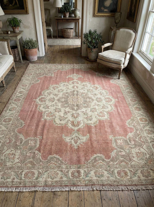 Translation missing: en.Hand knotted Oushak wool rug with faded pink medallion and vintage patina