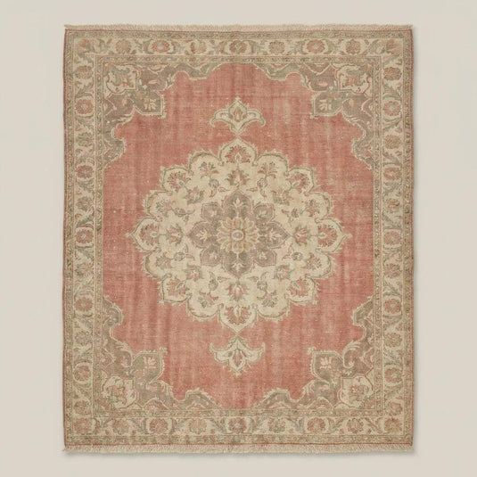 Translation missing: en.Traditional Oushak rug featuring floral medallion pattern in dusty pink and ivory tones