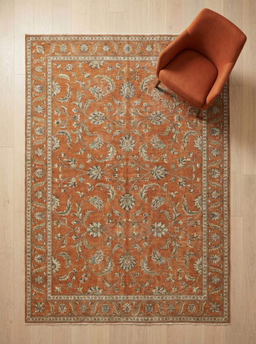 Translation missing: es.Hand knotted Oushak wool rug with terracotta rust floral design and low-pile finish