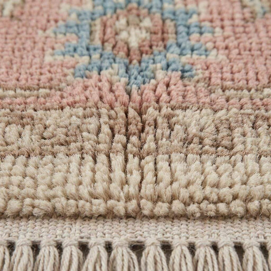 Translation missing: en.Close-up of hand knotted wool pile showing individual knots, soft wool fibers, and artisanal texture