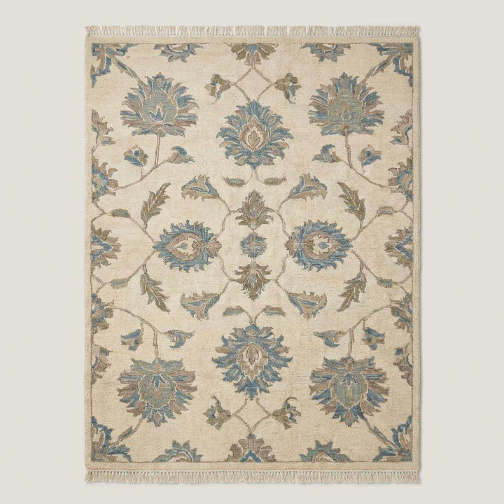 Translation missing: es.Traditional floral Oushak area rug in muted blue and cream colors with handcrafted wool pile