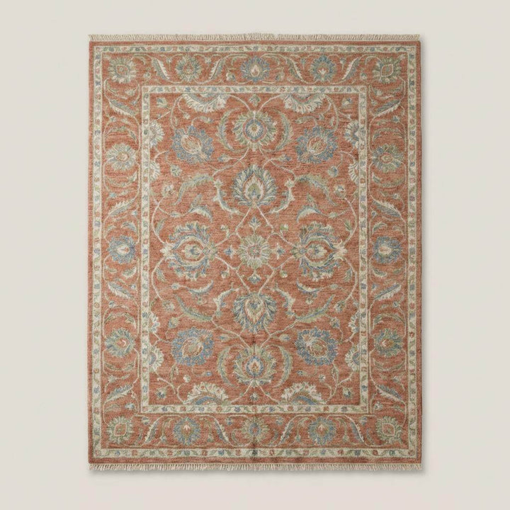 Translation missing: en.Traditional floral hand knotted wool rug styled in living room with warm neutral décor