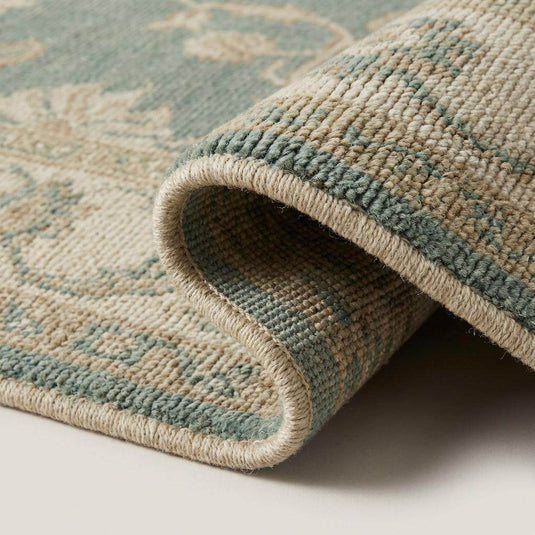 Translation missing: en.Close-up of hand knotted wool rug showing low pile texture and individual knot structure