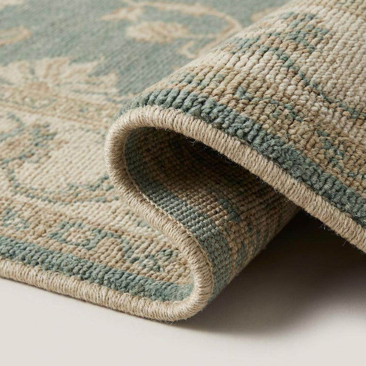 Translation missing: en.Close-up of hand knotted wool rug showing low pile texture and individual knot structure