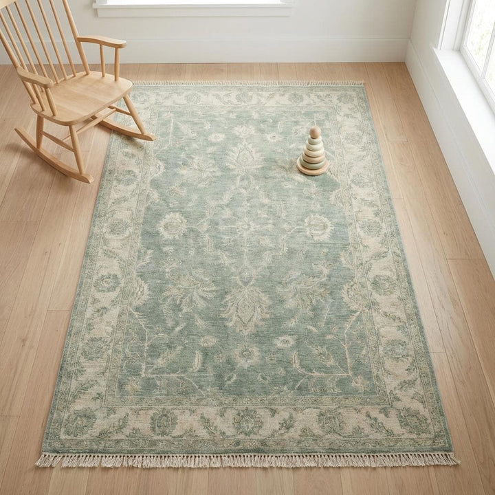 Translation missing: en.Muted green hand knotted area rug blending classic craftsmanship with modern transitional home styling