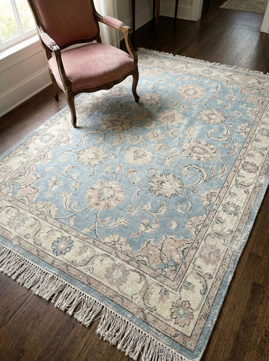 Translation missing: es.Hand knotted Oushak wool rug with soft blue floral design and natural wool texture