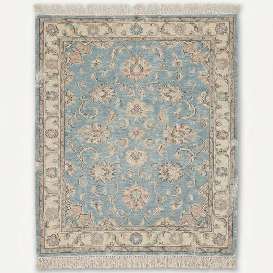 Translation missing: es.Traditional Oushak style wool rug with light blue field and ivory floral border details