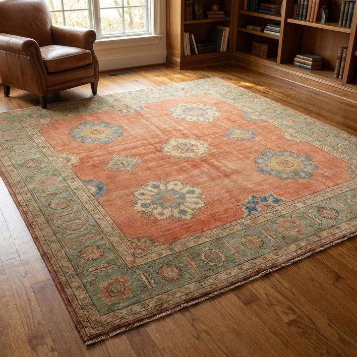Translation missing: en.Floral medallion motif on hand knotted Oushak rug with soft blue and ivory accents