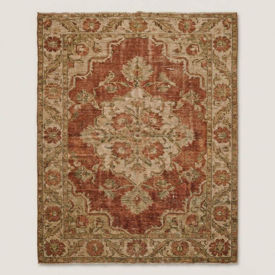 Translation missing: es.Vintage style Oushak area rug featuring floral medallion and soft distressed finish