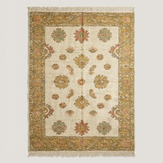 Translation missing: es.Vintage style Oushak area rug with traditional floral pattern and warm gold border styled on natural wood flooring