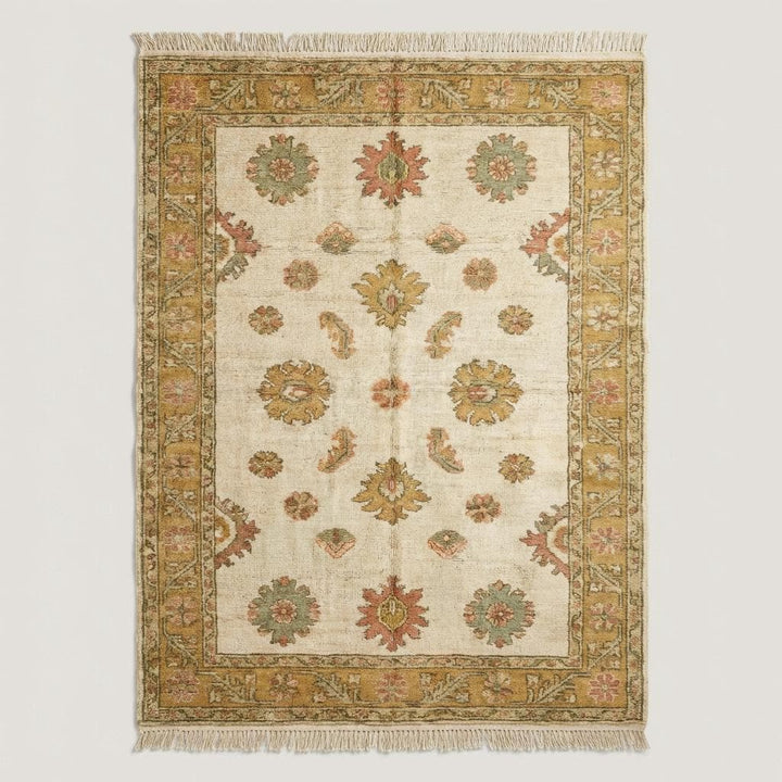 Translation missing: en.Vintage style Oushak area rug with traditional floral pattern and warm gold border styled on natural wood flooring