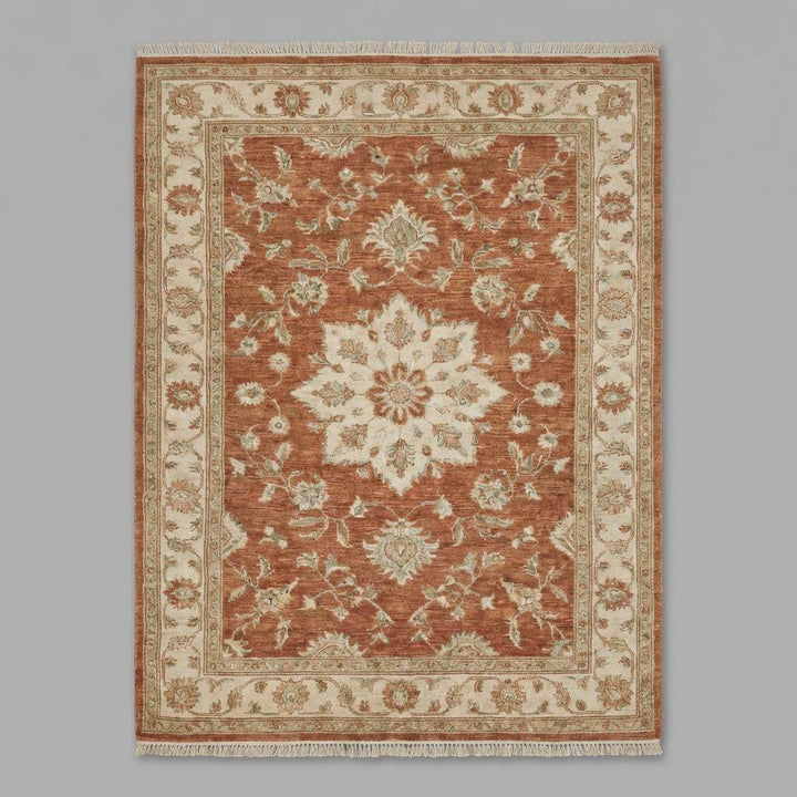 Translation missing: en.Living room styled with hand knotted wool area rug on dark wood flooring