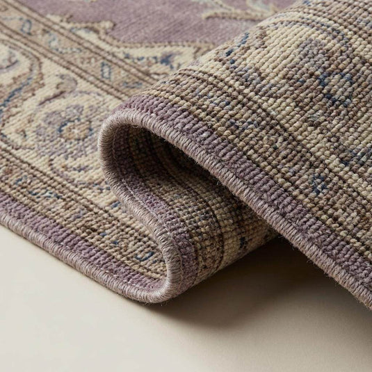 Translation missing: en.Close-up of hand knotted wool rug showing dense knot structure, natural wool fibers, and detailed craftsmanship
