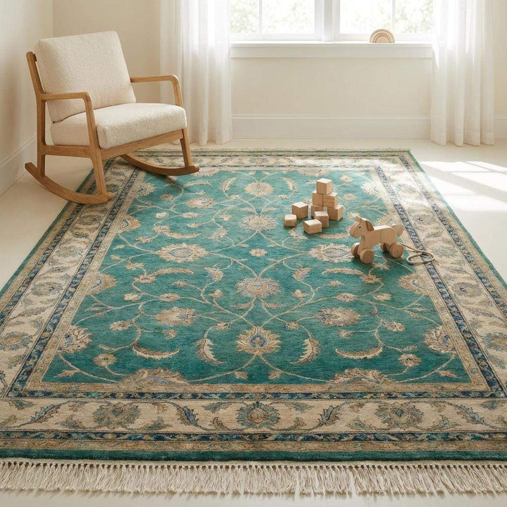 Translation missing: en.Angled perspective of teal wool area rug showing sheen and thickness on a wooden floor