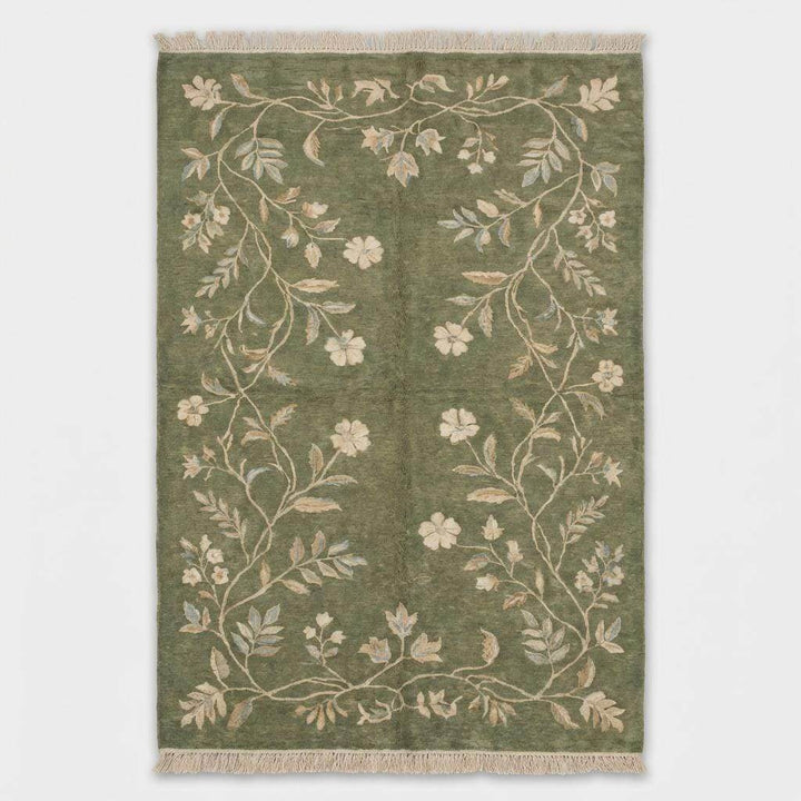 Translation missing: es.Floral hand knotted wool area rug with ivory and muted blue botanical details