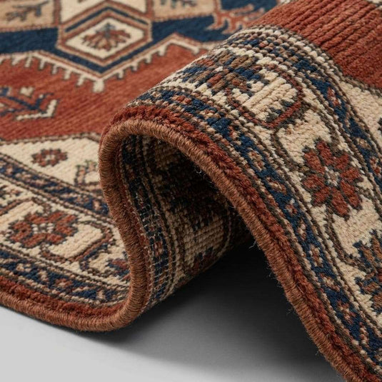 Translation missing: en.Close up of hand knotted wool pile showing dense knots, natural fiber texture, and artisanal craftsmanship