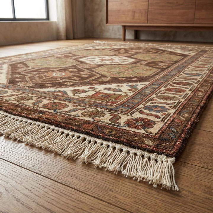 Translation missing: es.Artisan made wool area rug featuring rich earth tones and symmetrical tribal border patterns