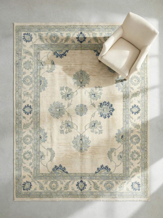 Translation missing: en.Hand knotted wool Oushak rug with muted blue floral design and vintage botanical motifs