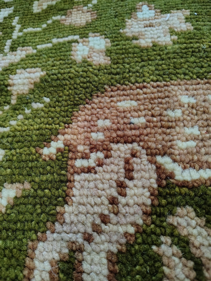 Translation missing: es.Hand knotted wool rug with Persian animal motifs, olive green field, and navy floral border