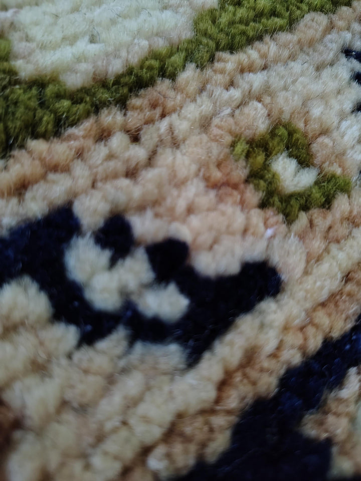 Translation missing: es.Hand knotted wool rug with Persian animal motifs, olive green field, and navy floral border