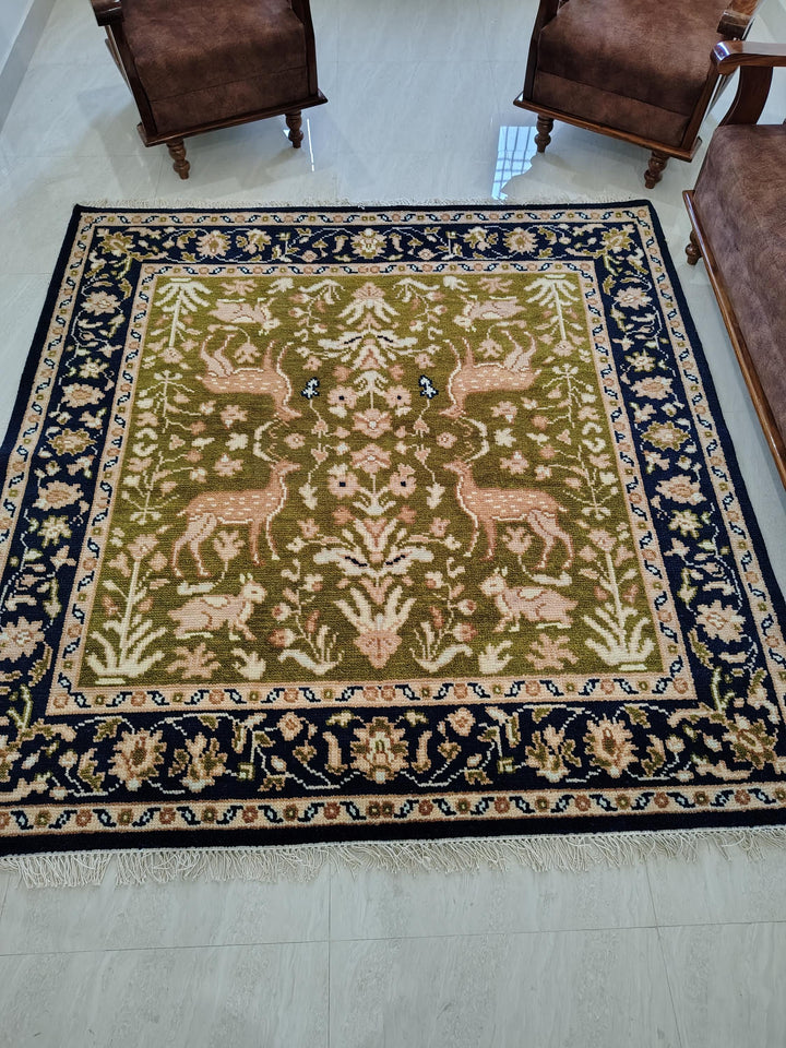 Translation missing: es.Hand knotted wool rug with green Persian animal design and navy floral border
