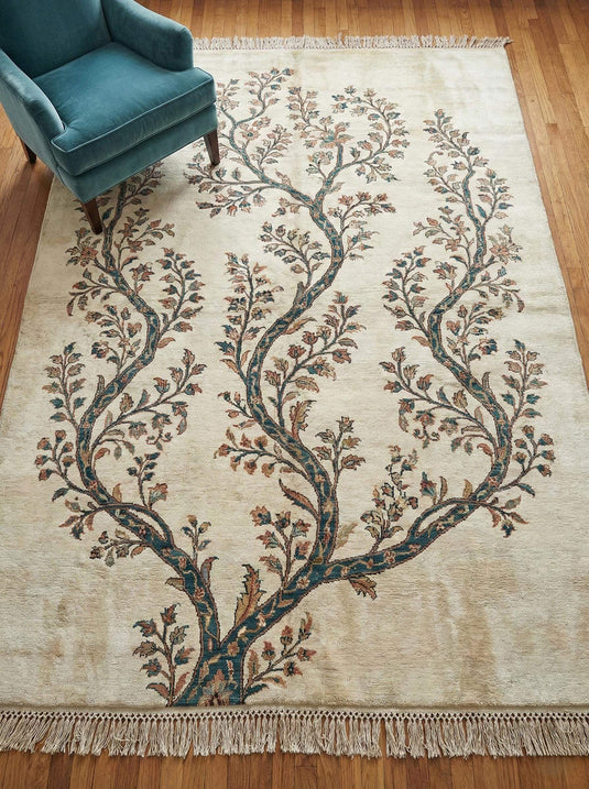 Translation missing: en.Hand knotted wool rug with ivory base and teal botanical Tree of Life design for durable, artisan home decor