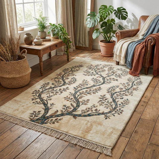 Translation missing: en.Botanical ivory rug featuring a symmetrical branching tree design with earthy terracotta and gold floral accents on deep teal branches