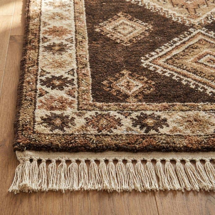 Translation missing: en.Close-up of hand knotted wool rug showing dense knots, natural wool fibers, and textured pile