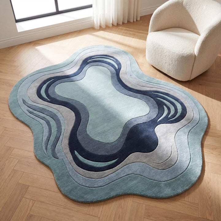 Translation missing: es.Handmade abstract wool rug with organic curved shape in sage blue and navy tones styled in a modern living room __etsy:8065990749