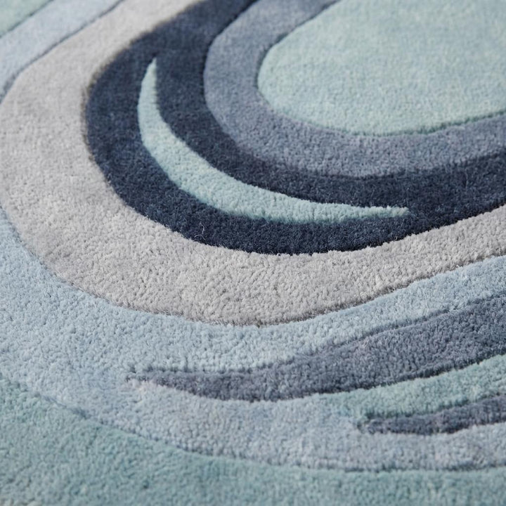 Translation missing: es.Close-up texture of hand tufted wool rug showing carved abstract detailing, soft cut pile, and layered artisan craftsmanship __etsy:8065990695