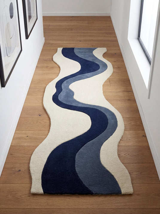 Translation missing: es.Hand tufted abstract runner rug with navy blue wave design on ivory background, irregular shape hallway carpet