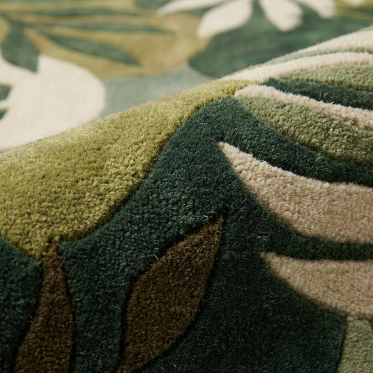 Translation missing: en.Close-up of dense wool hand tufted cut pile rug texture with carved botanical leaf pattern and sculpted pile detail