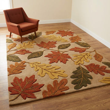 Translation missing: fr.Hand tufted wool area rug with autumn leaf pattern in rust, mustard, and olive tones on beige background