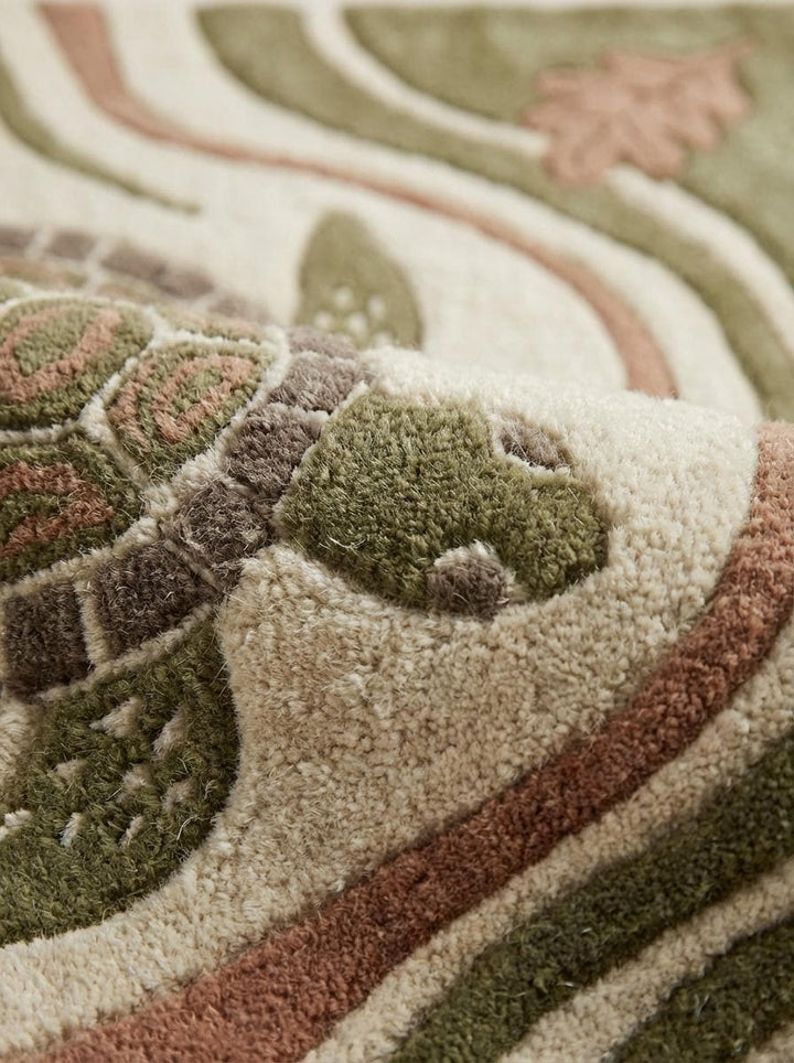 Translation missing: en.Close-up of dense wool hand-tufted pile showing raised carved turtle shell and leaf detailing with soft high-low texture