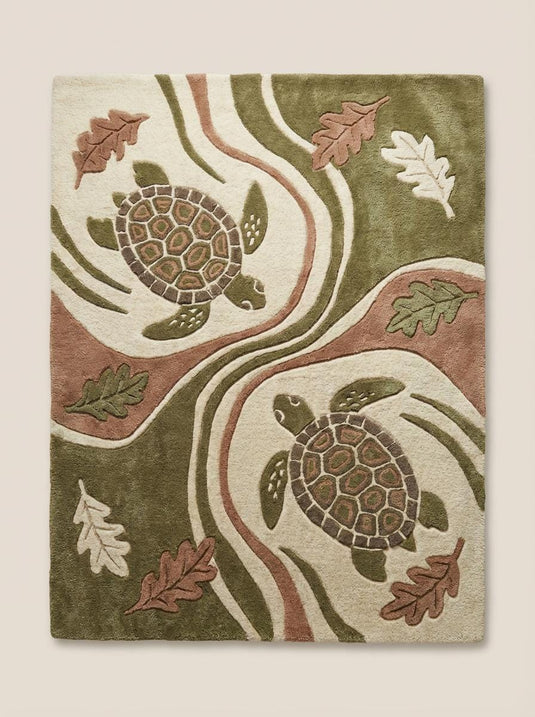 Translation missing: en.Nature inspired coastal turtle rug under wooden coffee table beside green accent chair in bright interior