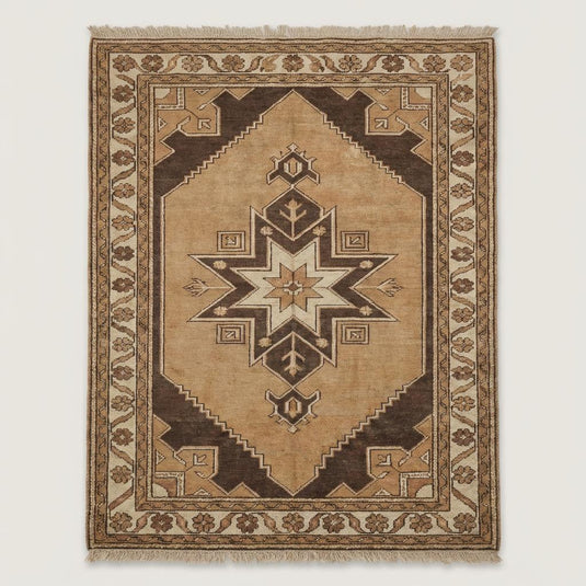 Translation missing: fr.Traditional tribal hand knotted area rug featuring geometric motifs and neutral colors on wooden flooring