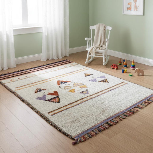 Translation missing: es.Wool pastel rug in nursery with blush tones, soft cream base and bohemian tribal pattern
