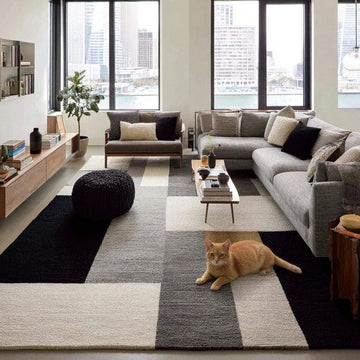 Translation missing: en.Handmade geometric wool area rug with modern black, gray, and cream block pattern