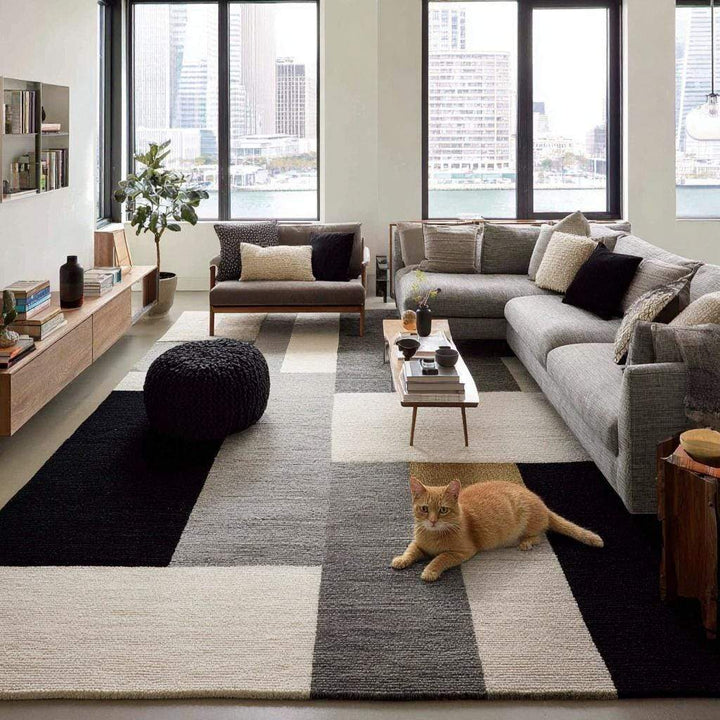 Translation missing: en.Handmade geometric wool area rug with modern black, gray, and cream block pattern