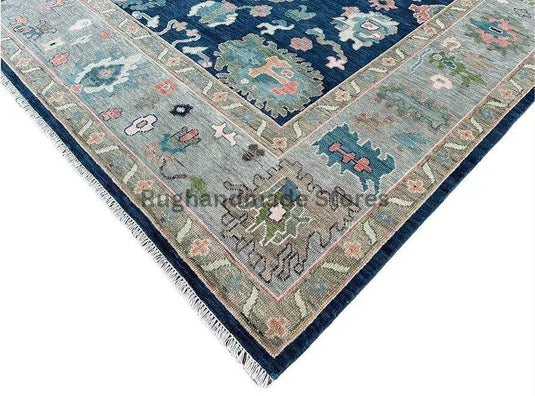 Translation missing: en.Handmade Oushak wool rug in blue and gray with intricate floral Turkish knot design for living room decor
