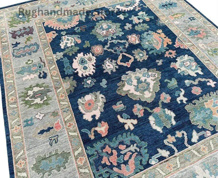 Translation missing: en.Handmade Oushak wool rug in blue and gray with intricate floral Turkish knot design, perfect for living room decor