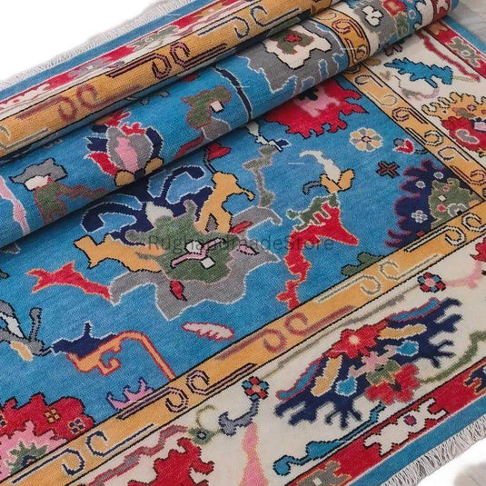 Translation missing: es.Handmade Oushak wool rug in dark blue with floral Turkish knot design, 8x10 area rug