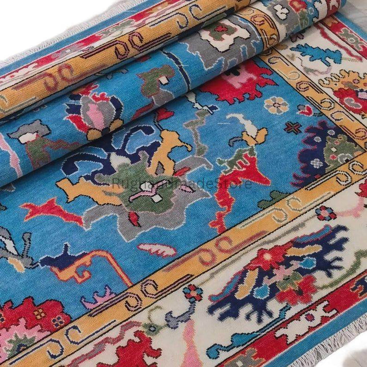Translation missing: es.Handmade Oushak wool rug in dark blue with floral Turkish knot design, 8x10 area rug