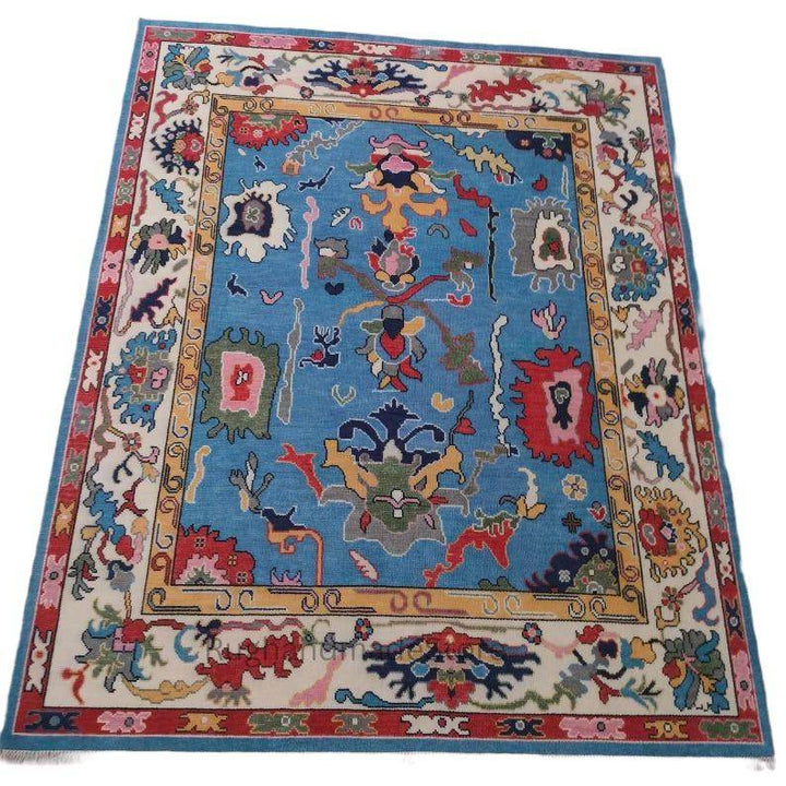 Translation missing: es.Handmade Oushak wool rug with dark blue Turkish knot floral design, 8x10 area rug for living room and home decor