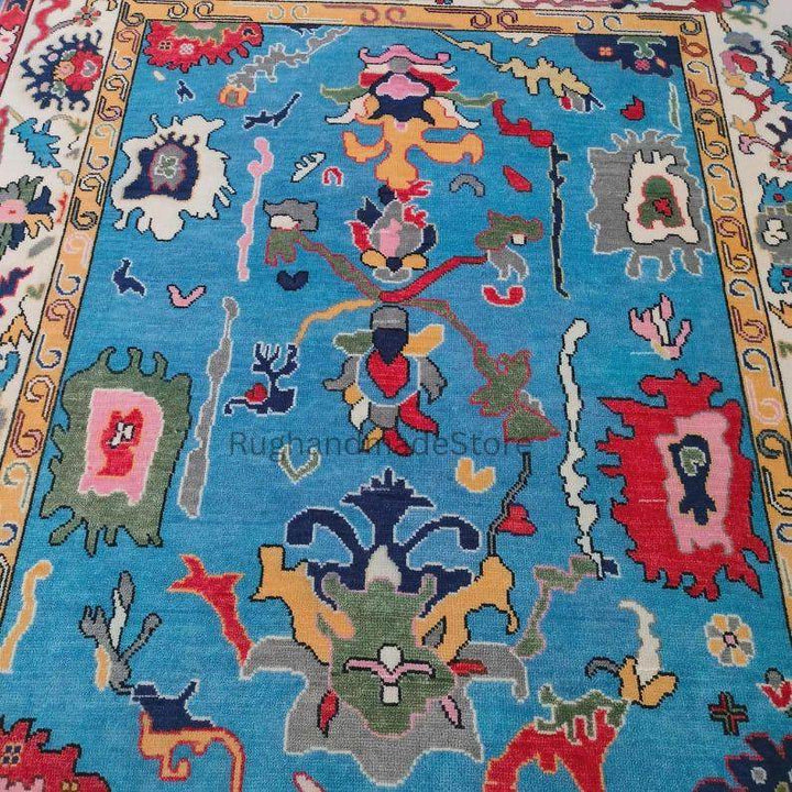 Translation missing: es.Handmade Oushak wool rug in dark blue with floral Turkish knot design, 8x10 area rug