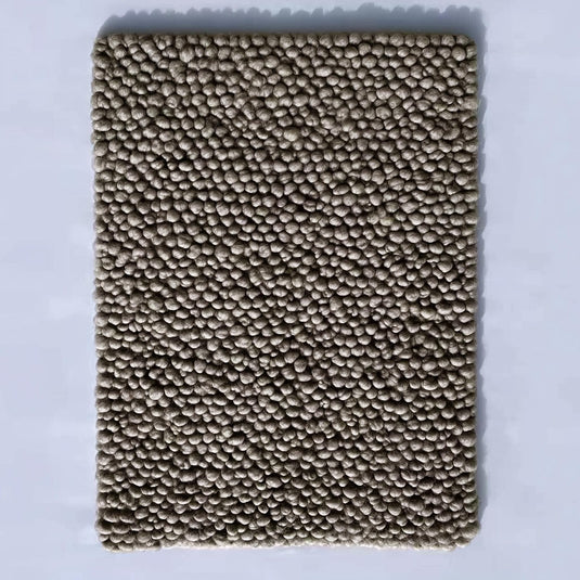 Translation missing: es.Top view of a handmade rectangular taupe felt ball rug with dense small pom-pom texture — chunky wool mat for living room, nursery or entryway